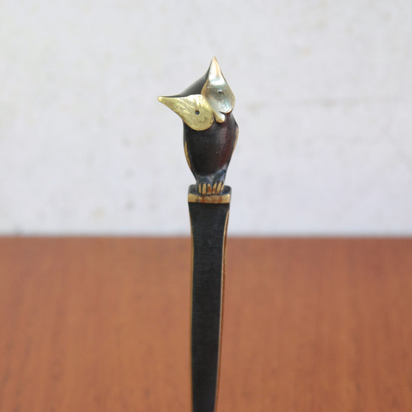 Decorative early-1950s Modernist letter opener topped with a stylised owl. The design is a famous black and gold creation by Walter Bosse and Herta Baller.