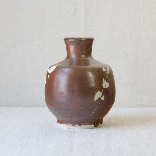 A Kaki glaze British Studio Pottery stoneware vase, handmade by Jim Malone in Ainstable, England. Brown glaze with abstract decoration.