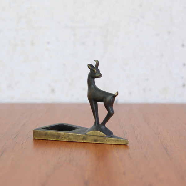 A Richard Rohac brass bottle opener with stylised chamois goat figurine, handmade in Vienna.