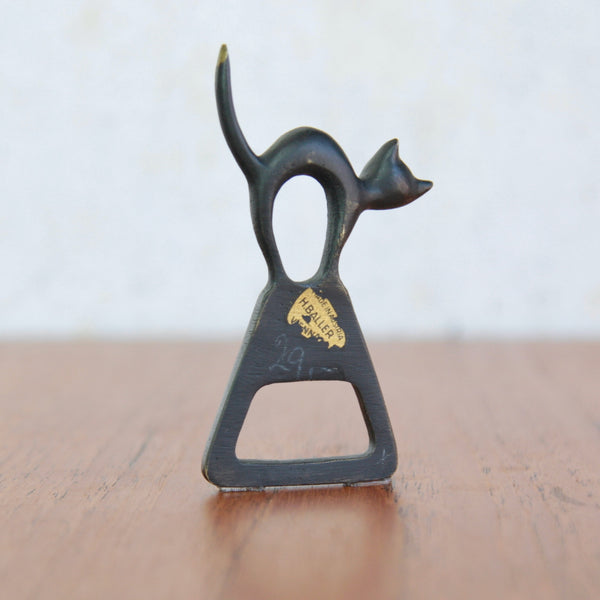 Baller Austria Gold Sticker "H.Baller" on a whimsical Walter Bosse witches’ cat caplifter, made during the 1950s modernist design movement.