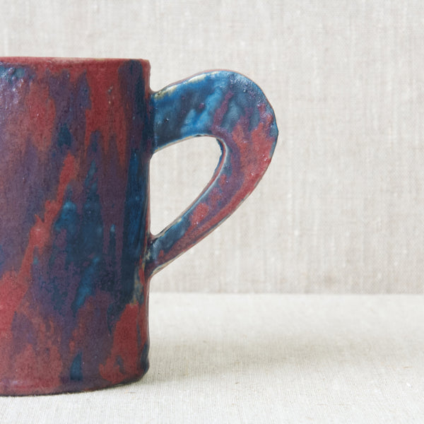 Head on shot of a large ear shaped handle on an Emmanuel Cooper jug. The handle is geometric but clearly handmade. This item is available to view and buy from South West London based Art & Utility. 