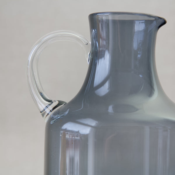 Clear glass handle of lilac 1603 pitcher by Kaj Franck 