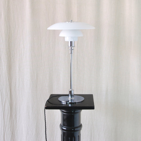 Poul Henningsen PH 3/2 lamp showing three carefully proportioned opaline glass shades designed to diffuse light and reduce glare.