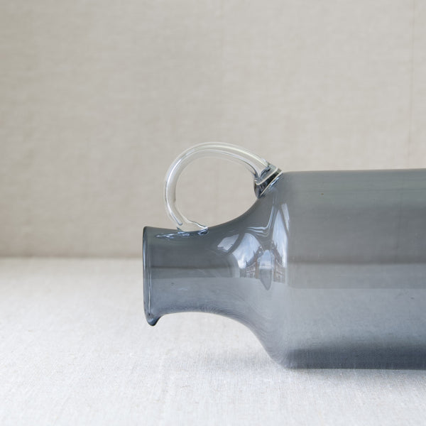 Detail of glass handle of Kaj Franck Modernist glass pitcher 1603