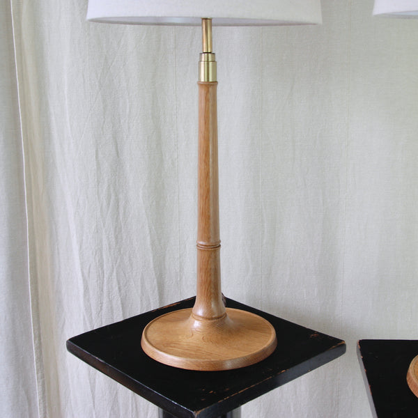Detail of the turned solid oak stem on Kaare Klint's Model 301 for Le Klint, with two collars reminiscent of bamboo knuckles.