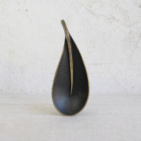 A sculptural Richard Rohac tray in brass, versatile as a decorative catchall or desk accessory.