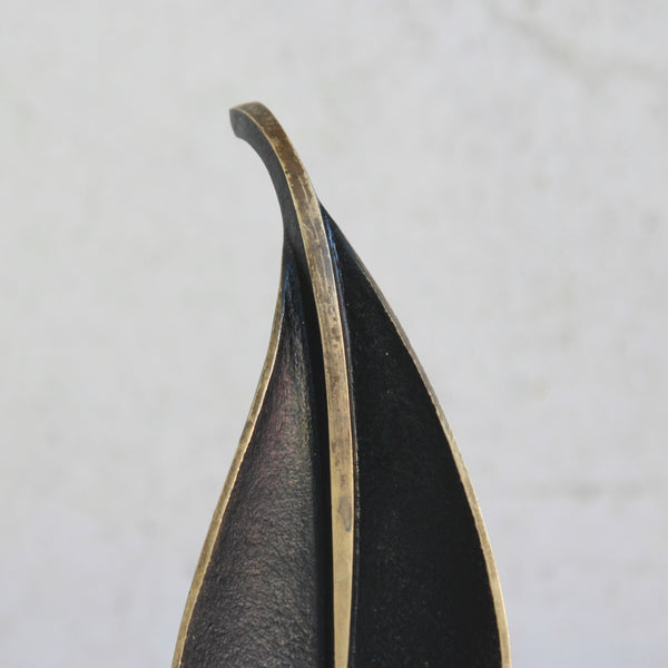 A sculptural Richard Rohac brass tray with black patina and polished highlights, exemplifying Viennese mid-century design.