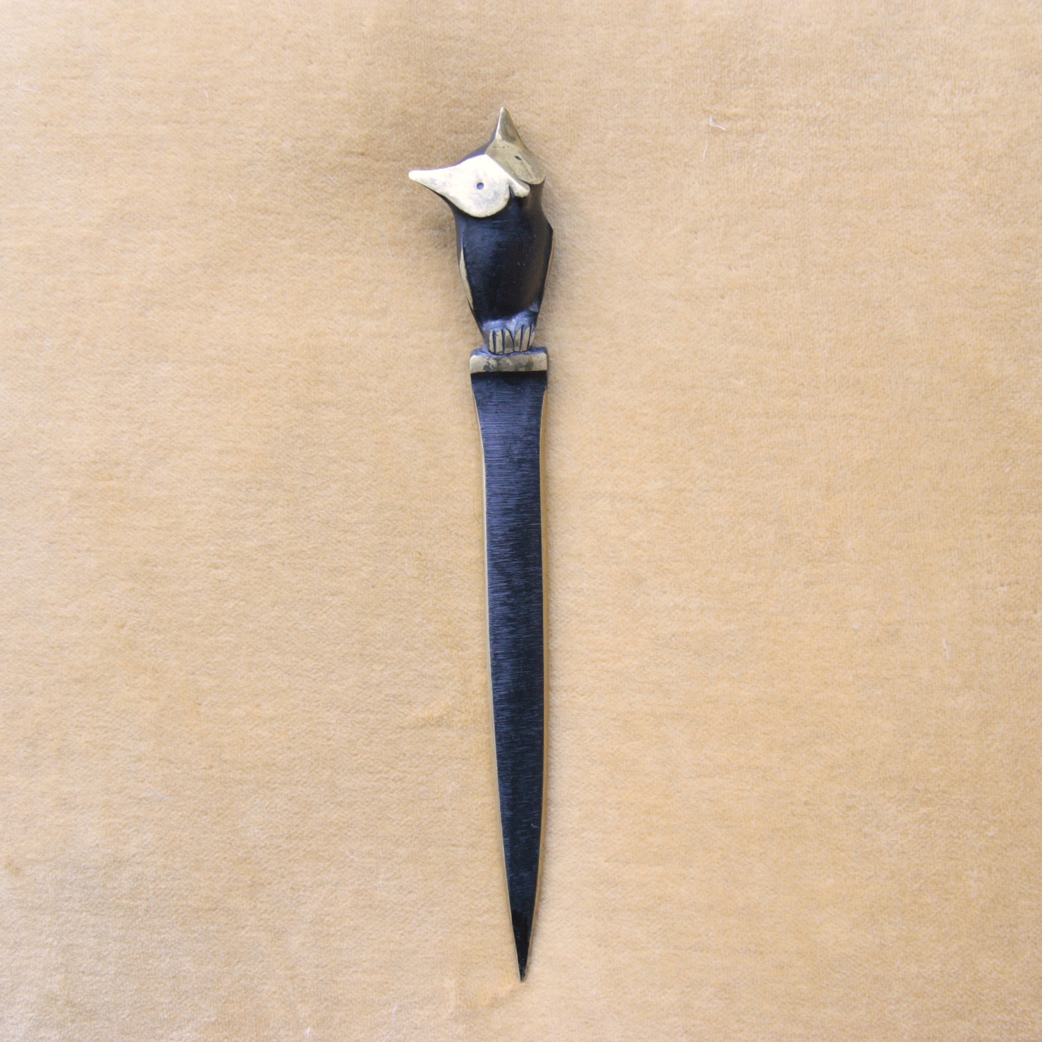 Early 1950s Herta Baller produced Walter Bosse letter opener adorned with a large and beautifully sculptured owl. A fantastic example of Midcentury Modernism in Austrian metalwork. For sale at design gallery Art & Utility.