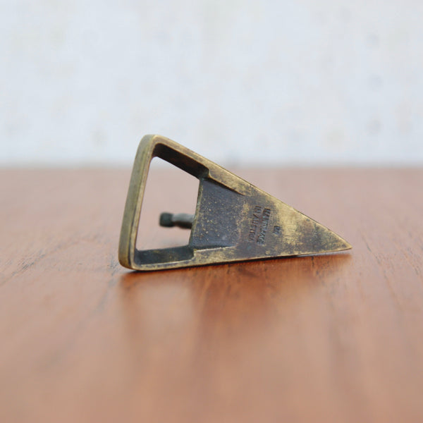 A 1950s brass bottle opener by Richard Rohac, showing an elegant stylised mountain goat and marks "RR" "Handmade in Austria".