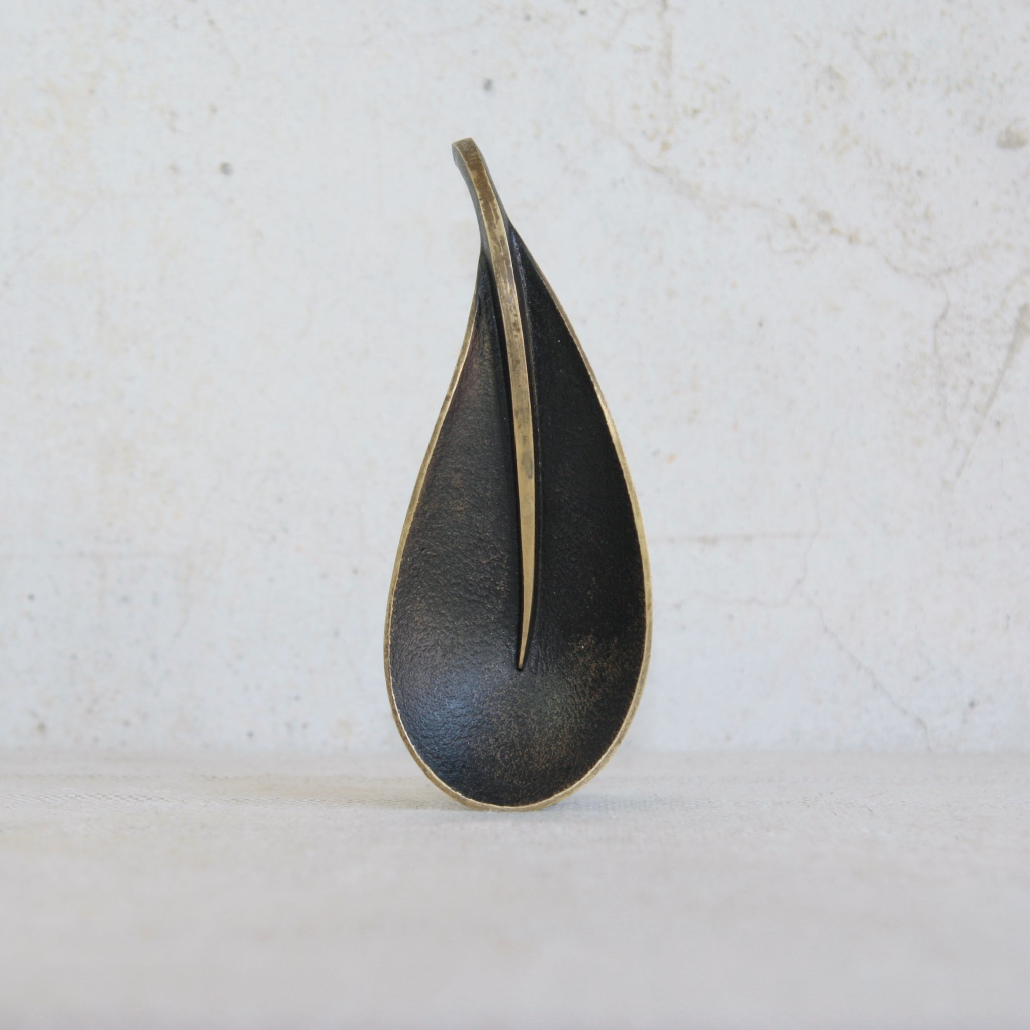 A mid-century brass leaf tray by Richard Rohac, handmade in Vienna, Austria, with patinated and polished finish.