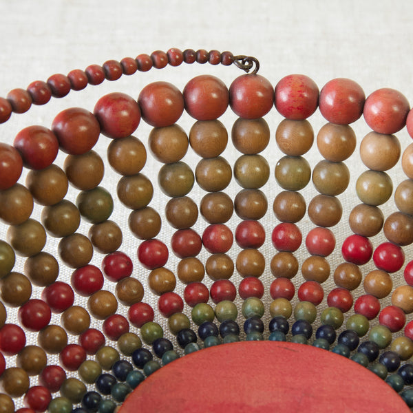 Detail of coloured wooden beads, used to make a fruit bowl