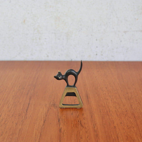 A rare mid-century modern black cat caplifter by Walter Bosse for Baller Austria, a stylish collectible design.