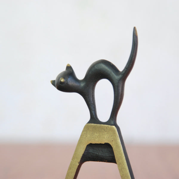 Detail of Stylish 1950s Walter Bosse black cat bottle opener, collectible Viennese brassware by Baller Austria.