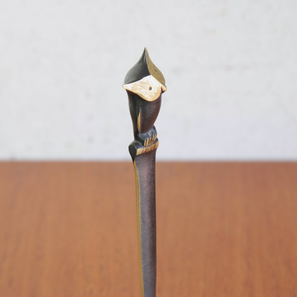 A Modernist sculpture of an owl atop a letter opener, desk accessory. The vintage design is by Walter Bosse whose work is widely available for sale from design gallery Art & Uility.