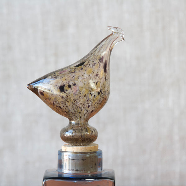 Head on shot of a Nuutajarvi Notsjo model kf 254 hen bottle designed by Kaj Frank, this serious piece of collectible glass remains an influential symbol of the mid-century modern design movement celebrated worldwide.
