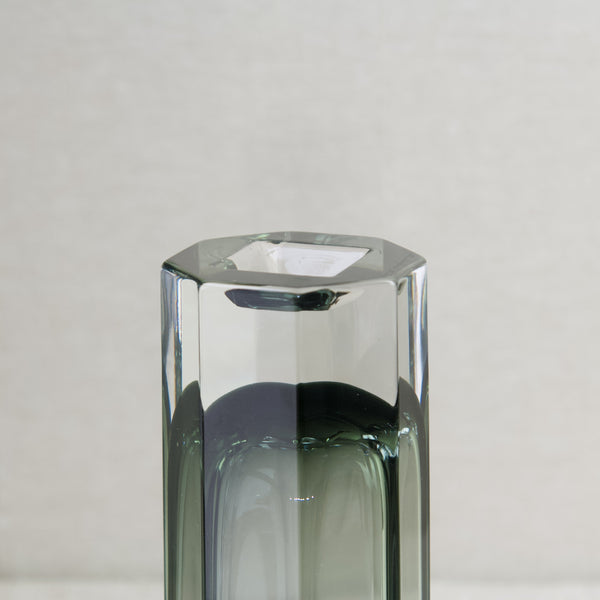 Top down view of the base of a Kaj Franck Sommerso vase. The main body is grey glass covered by clear whilst the foot or base is entirely clear glass. This highly crafted piece of 20th century design was made by Nuutajarvi Glassworks.