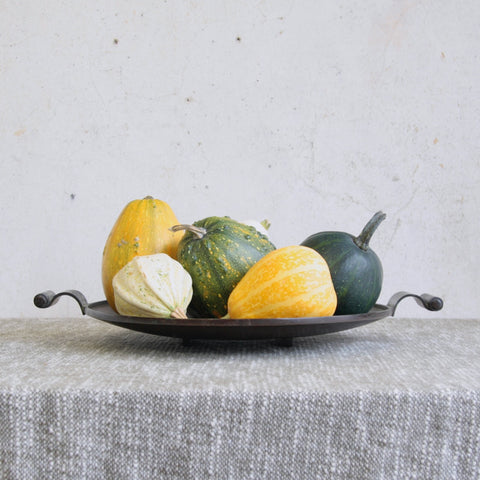 A large solid bronze platter with scroll handles designed by Einar and Sune Bäckström, Sweden, c.1934. Decorated with allotment gourds, this exceptional piece exemplifies early 20th-century Scandinavian craftsmanship and sculptural design.