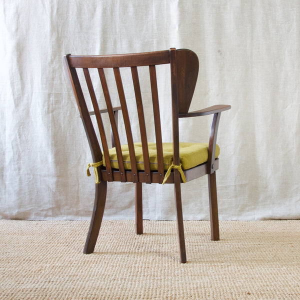 Christian E. Hansen's 'Canada' armchair, a mid-20th century icon that epitomizes Fritz Hansen's forward thinking and excellence in cabinet making.