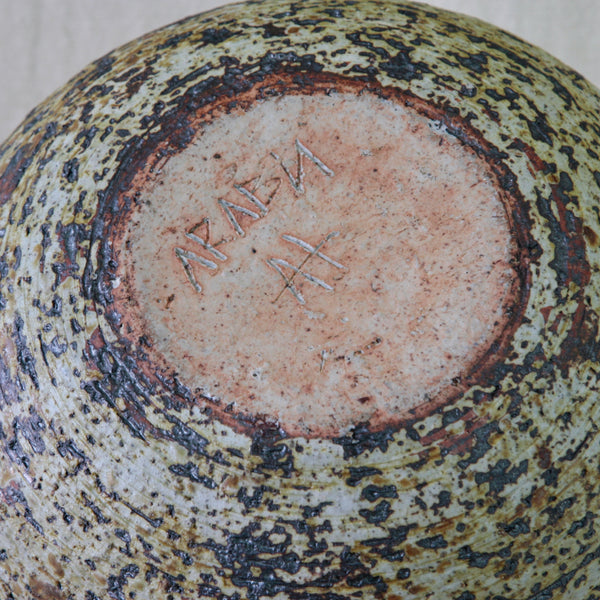 Underside of an Annikki Hovisaari studio vase for Arabia Finland, showing the incised artist and factory signature “AH ARABIA”.