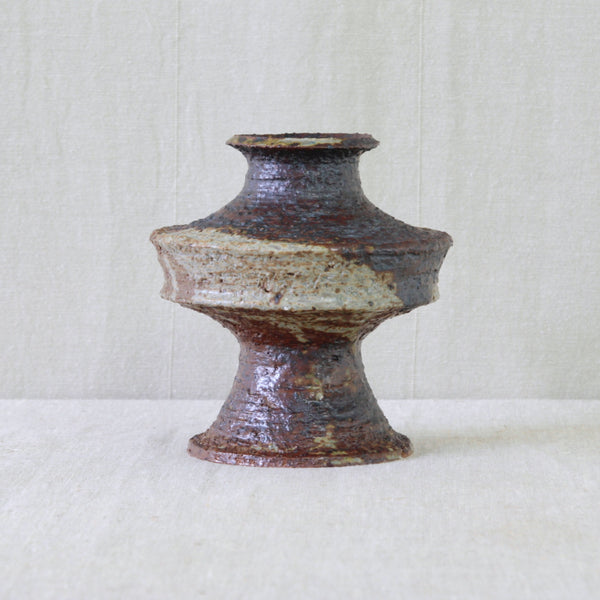 1960s studio pottery vase by Annikki Hovisaari for Arabia, combining a constructed sculptural form with expressive ochre and brown glazing.
