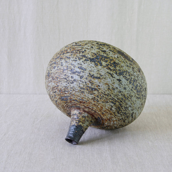 Annikki Hovisaari chamotte clay vase for Arabia Finland, with coarse textured stoneware picked out in earthy brown and ochre glazes.