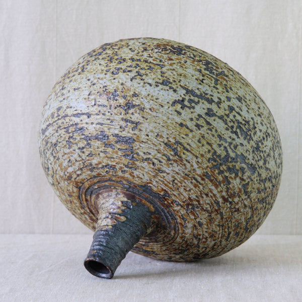 Handmade Annikki Hovisaari vase showing the artist’s finger marks spiralling upwards through the clay towards the narrow rim.