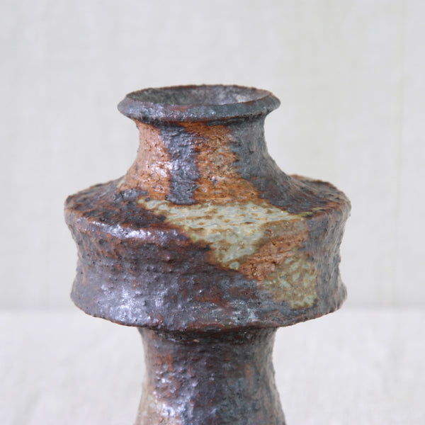 Chamotte detail on studio vase by Annikki Hovisaari for Arabia Finland, with an expressive rust and brown glaze.