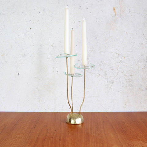 Mid-century Scandinavian candlestick in brass and glass with floral form, 1960s design.