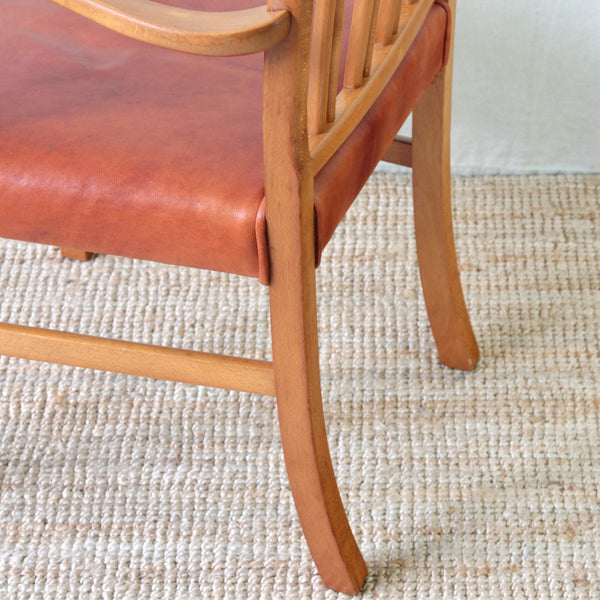 Collectable Ole Wanscher Model 1675 Danish armchair for Fritz Hansen, with curved beech frame and newly upholstered red leather seat.