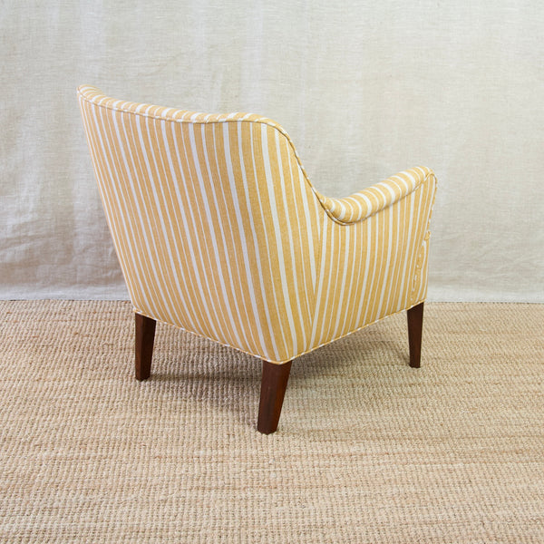 Danish design excellence on display in this vintage Model 1748 lounge chair, an elegant Danish design by Peter Hvidt & Orla Mølgaard-Nielsen for Fritz Hansen.