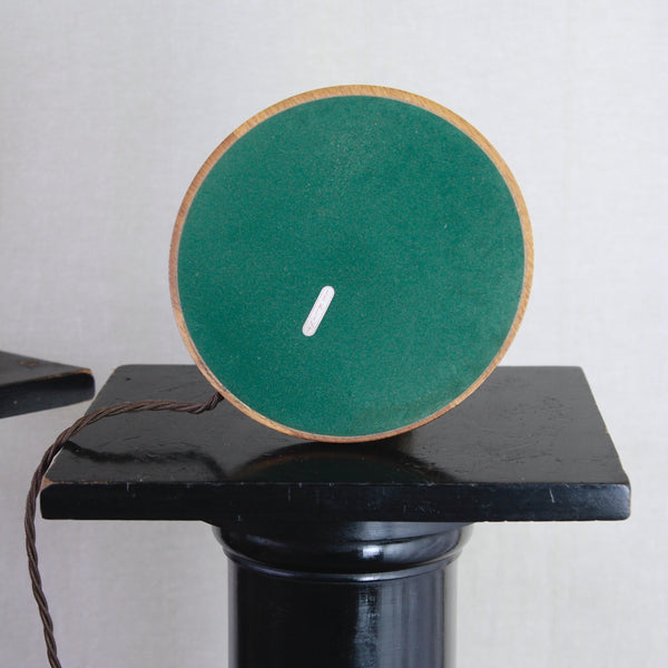 Underside or base of a rare Esben Klint Scandinavian Modern oak and brass table lamp for Le Klint. Light retains original manufacturers mark / makers sticker.