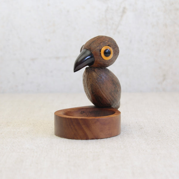 YZ nut bird coin tray or ashtray designed by Bernard Charles Howell, a rare Art Deco object combining mahogany, coquilla nut, cherry amber Bakelite made from Faturan resin and cased glass. Rare British Modernism for sale in the UK from design gallery Art & Utility.