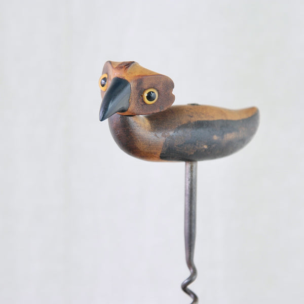 Close view of the rattan head and carved wooden body of a 1925 YZ bird corkscrew by Bernard Charles Howell.