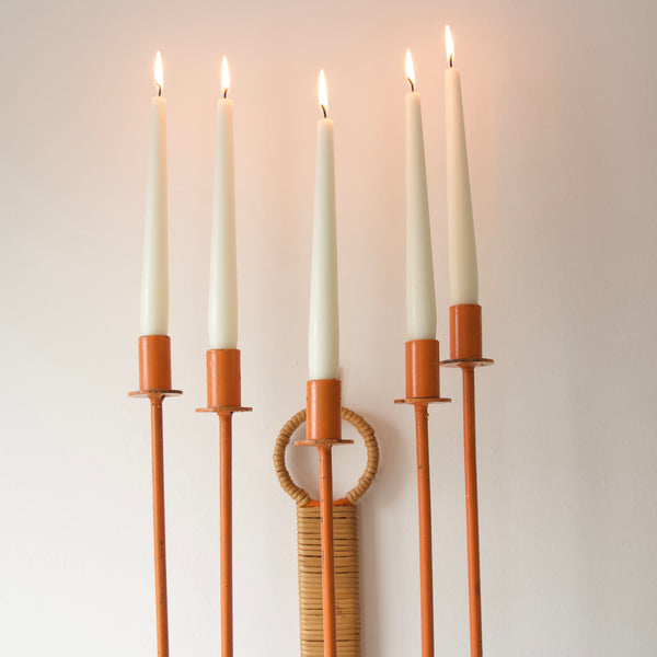 This impressive candelabrum in orange by Arthur Umanoff for Raymor features five elegantly curved arms, each adorned with a candle sconce.