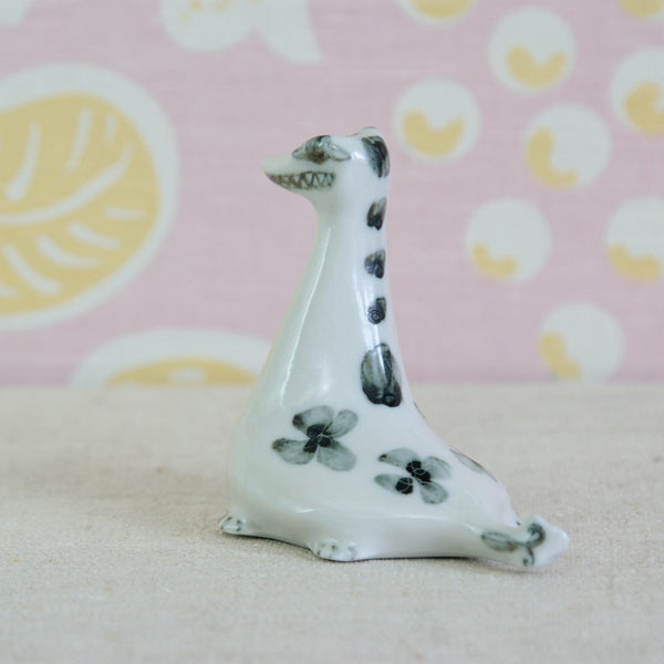 Susan Parkinson porcelain Loch Ness Monster with sculptural body, fin-like tail and spontaneous painted decoration. A very rare Richard Parkinson Pottery figurine.