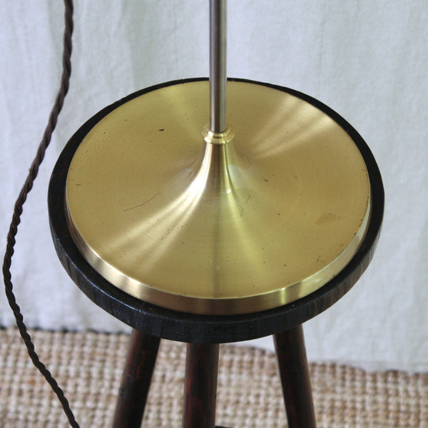 A close-up of a vintage 1960s Le Klint Model 319 table light by Esben Klint, with an circular polished brushed brass base.