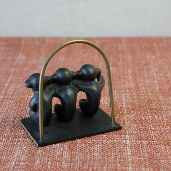 Rear view of Walter Bosse brass patinated letter rack 'three wise monkeys'