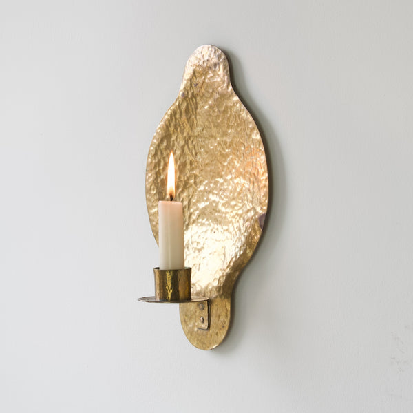 Vintage Swedish brass wall sconce, circa 1950, handcrafted with unique hammered detailing.