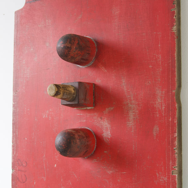 Detail of industrial art wall hanging sculpture, a wooden mould for machine parts