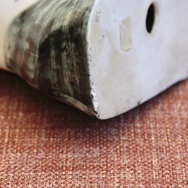 Close-up of manufacturing flaw on a collectible mid-century English porcelain figure group by Susan Parkinson, The 8.15, capturing the character of post-war British commuter life.