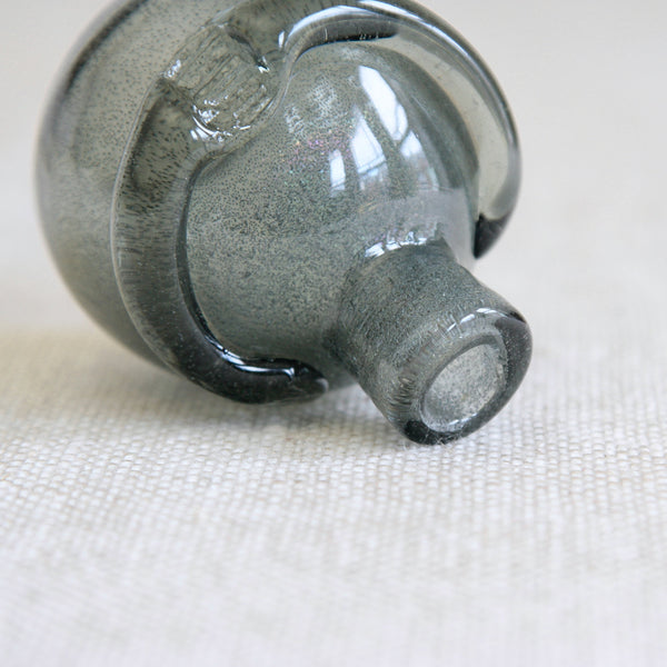 Detail of glittery glass used in a collectible Swedish mid-century design by Erik Höglund, an early prototype preceding his iconic bubble-glass People decanters.