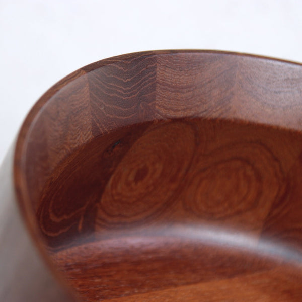 Angled rim on a sculptural Danish teak bowl by Jens Quistgaard, 1960s. A refined Dansk Designs classic combining balance, warmth, and form.