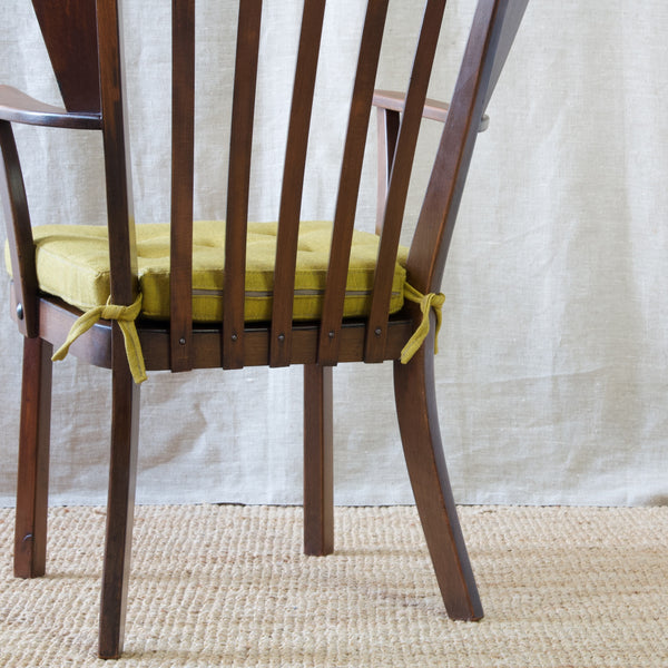 Christian E. Hansen's 'Canada' armchair, a collectible piece of Nordic design history brought to life by Fritz Hansen's legendary craftsmanship.