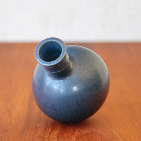 Close-up view of the body of a Wilhelm Kage vase revealing the wide mouth, incised rim, and glossy Hare Fur blue glaze associated with Scandinavian Modernism.