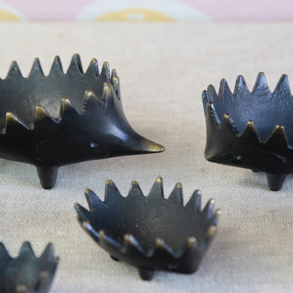 Complete family of six stacking hedgehog ashtrays designed by Walter Bosse in Germany during the 1950s, in black-patinated and polished brass.