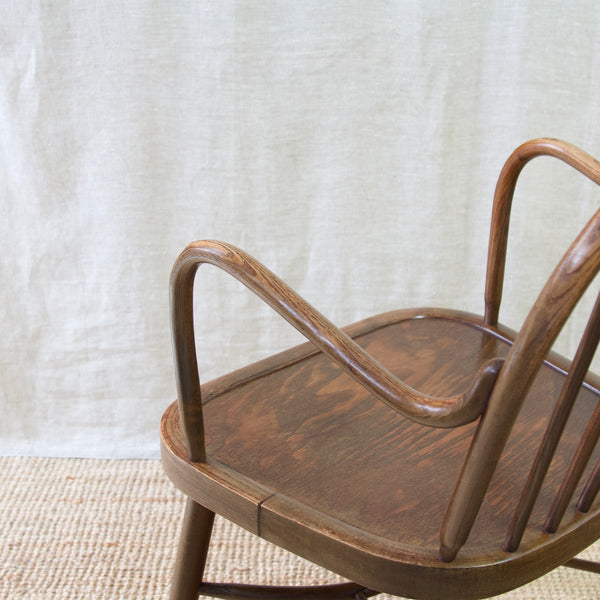 Enhance your decor with a rare Niels Eilersen Danish Windsor chair, embodying mid-20th-century design sophistication.