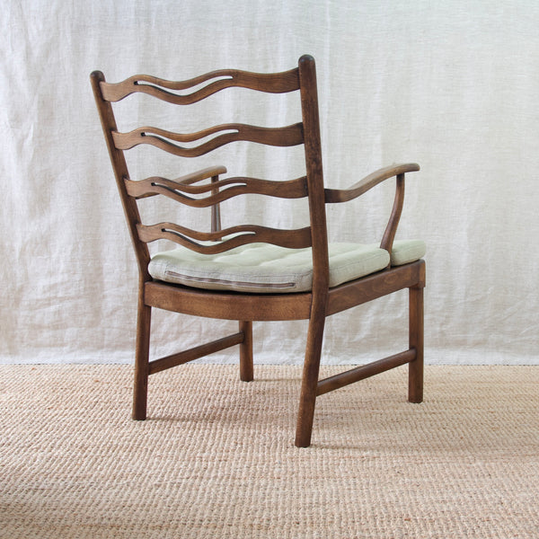 Reverse view of the midcentury modern Ole Wanscher 1755 ladder-back armchair, a stunning example of Fritz Hansen's iconic designs.