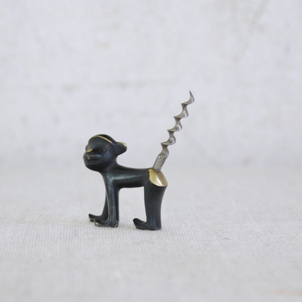 Rare Walter Bosse monkey corkscrew, handcrafted in brass with black patina; a sought-after Herta Baller design ideal for collectors of mid-century modern decorative objects.