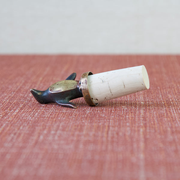 Turn heads at your next gathering with this patinated and polished brass Penguin shaped bottle stopper, a timeless creation by Walter Bosse for Herta Baller.