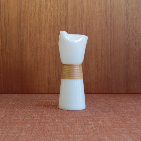 A mid-century Jacob Bang Opaline carafe with cane handle for Kastrup Glassworks, showing elegant Scandinavian craftsmanship admired by Nordic design collectors in Japan and Singapore.